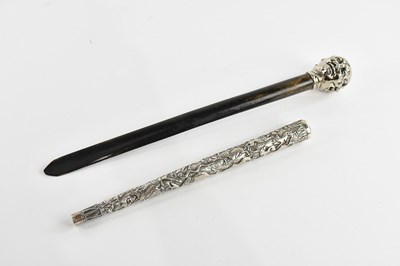Lot 1111 - An ebonised page turner, with multifaceted...
