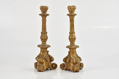 Lot 2038 - A pair of decorative giltwood candlesticks...