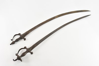Lot 1250 - Two Indian talwars, with steel blades, overall...