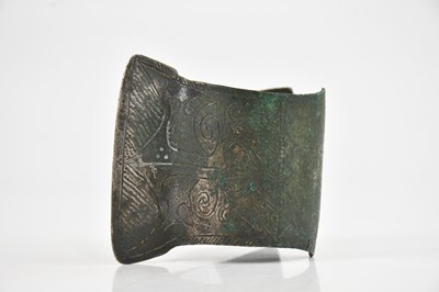 Lot 1727 - An Oriental white metal bangle, with chased...