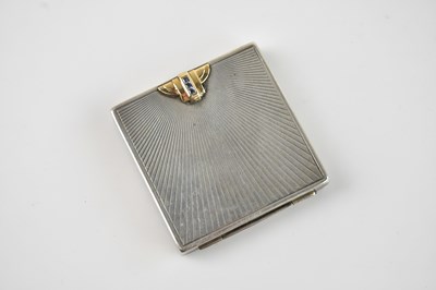 Lot 493 - A sterling silver and 14k gold compact, of...