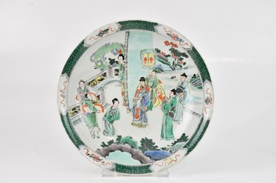 Lot 1645 - A Chinese Famile Verte plate, decorated with...