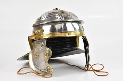 Lot 1264 - A reproduction Roman helmet (galea).