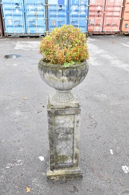Lot 344 - A reconstituted stone urn on detachable plinth,...