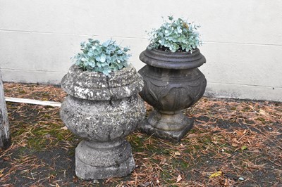 Lot 338 - Two reconstituted stone garden urns on square...