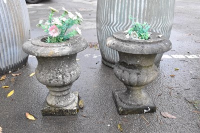 Lot 343 - Two miniature stone garden urns, height 30cm (2)