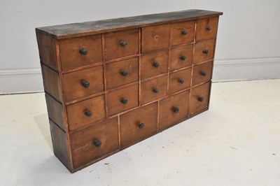 Lot 42 - A vintage stained pine haberdashery type...