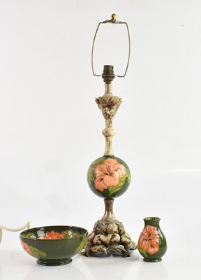 Lot 1393 - MOORCROFT; three pieces decorated in the...