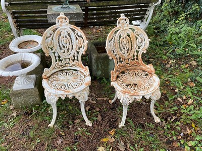 Lot 341 - A pair of cast iron garden chairs, height 83cm.