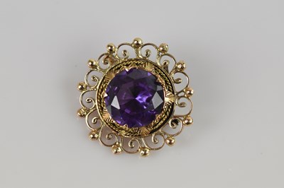 Lot 2057 - A yellow metal filigree mounted pendant, set...