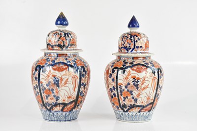 Lot 1695 - A pair of early 20th century Imari temple jars...