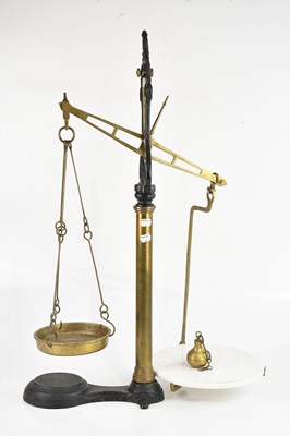 Lot 1183 - A pair of Victorian cast iron and brass scales,...