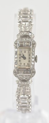 Lot 1610 - A 1920s/30s Art Deco platinum and diamond lady'...
