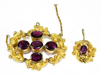 Lot 1415 - A Victorian yellow metal and demantoid garnet...