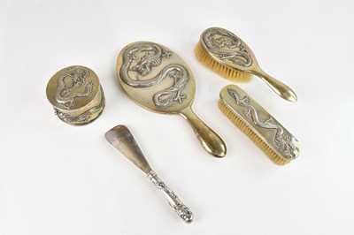 Lot 1574 - TUCK CHANG; a Chinese white metal four piece...