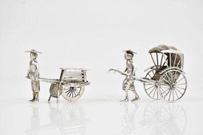 Lot 1622 - Two Chinese white metal models of two...