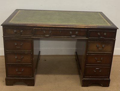 Lot 848 - A reproduction pedestal desk, the top having...