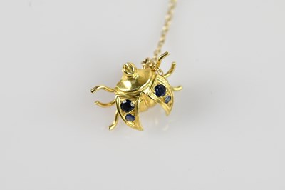 Lot 1329 - A yellow metal sapphire set brooch formed as a...