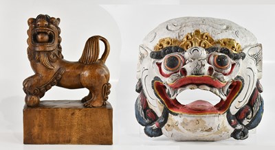 Lot 1621 - A large carved hardwood model of a shishi dog,...