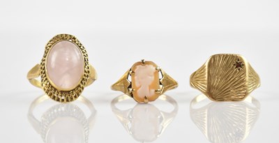 Lot 675 - A yellow metal cameo dress ring, size L, and...