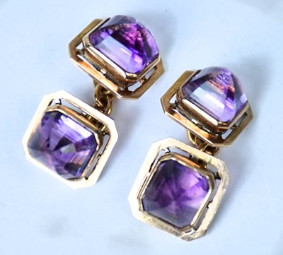 Lot 700 - A pair of yellow metal and amethyst cufflinks,...