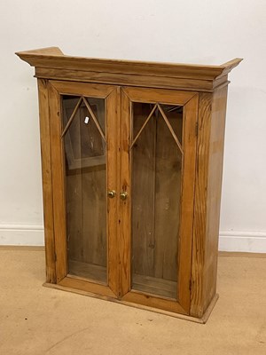 Lot 812 - A pine two door glazed wall cabinet, height...