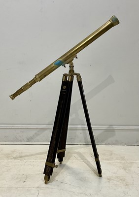 Lot 1151 - A reproduction brass telescope on tripod base,...