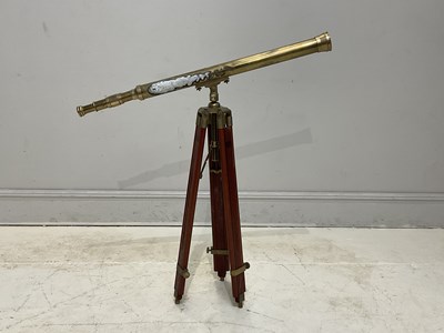Lot 1152 - A reproduction brass telescope on tripod base,...
