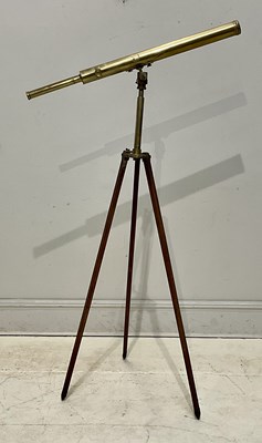 Lot 1148 - A single drawer brass telescope on tripod base,...