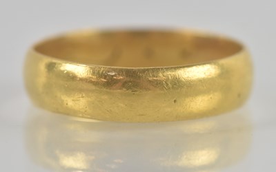 Lot 1315 - A yellow metal ring, unmarked (possibly high...