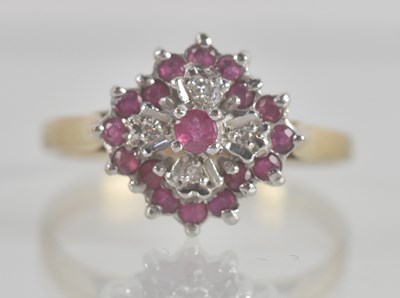 Lot 1335 - A 9ct yellow gold ruby and diamond cluster...