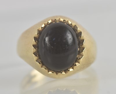 Lot 1314 - A black onyx ring with heavy setting, size X,...