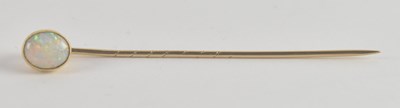 Lot 1286 - A gold coloured metal tie pin, with a bezel...