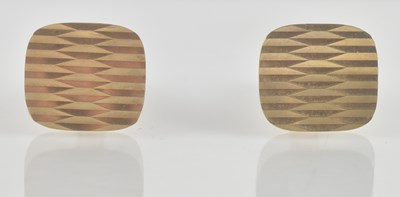 Lot 1434 - A pair of 9ct yellow gold cufflinks, with wavy...