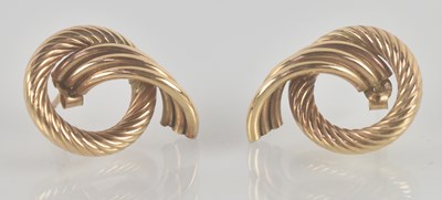 Lot 1432 - A pair of 9ct gold stud earrings, with scroll...