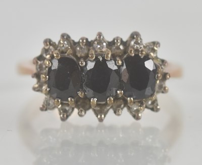 Lot 1328 - A 9ct yellow gold dress ring, with three claw...