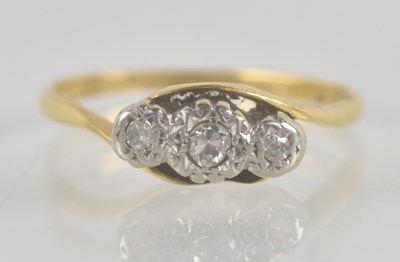 Lot 1341 - An 18ct yellow gold ring, with three tiny...