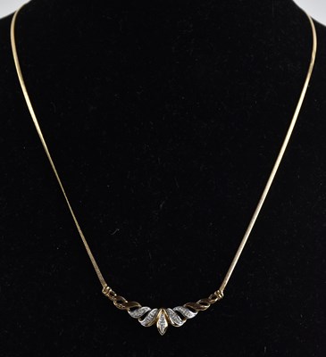 Lot 1396 - A 9ct yellow gold semi-rigid necklace, with...