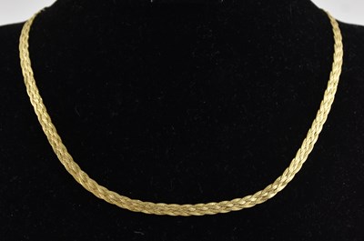 Lot 1400 - A 9ct bright yellow gold braided flat necklace,...