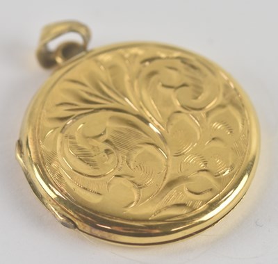 Lot 1415 - A 9ct yellow gold round double locket, with...