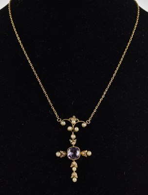 Lot 1391 - A 9ct gold amethyst and seed pearl cross...