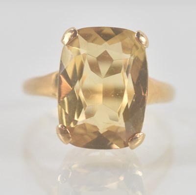 Lot 1340 - A 9ct yellow gold dress ring, with claw set...