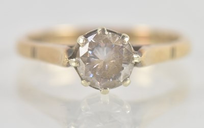 Lot 1348 - A 9ct yellow gold single white stone set dress...
