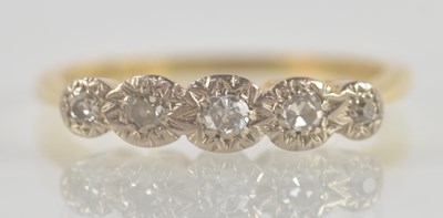 Lot 1330 - An 18ct yellow gold ring, set with five...
