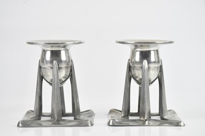 Lot 1387 - ARCHIBALD KNOX FOR ENGLISH PEWTER; a pair of...