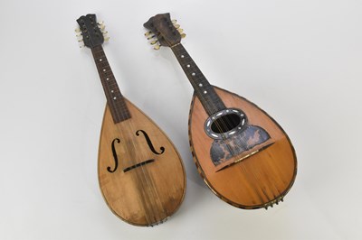 Lot 1360 - A bowl back mandolin and a further flat back...