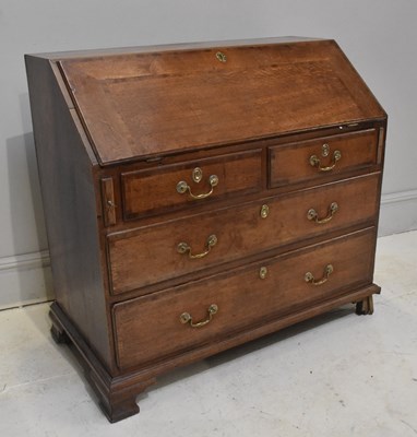Lot 2008 - An 18th century cross banded oak bureau, the...