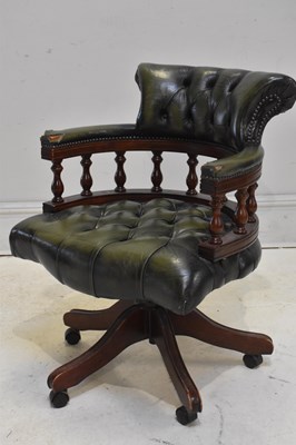 Lot 127 - A reproduction button back captain's swivel...
