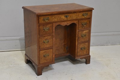 Lot 79 - A reproduction burr walnut kneehole desk, with...