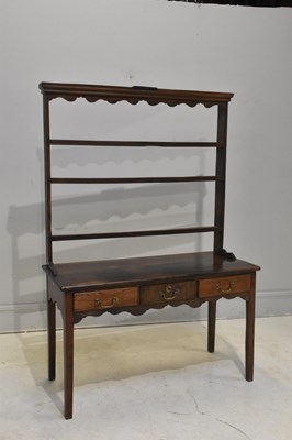 Lot 12 - An 18th century oak dresser, with open plate...